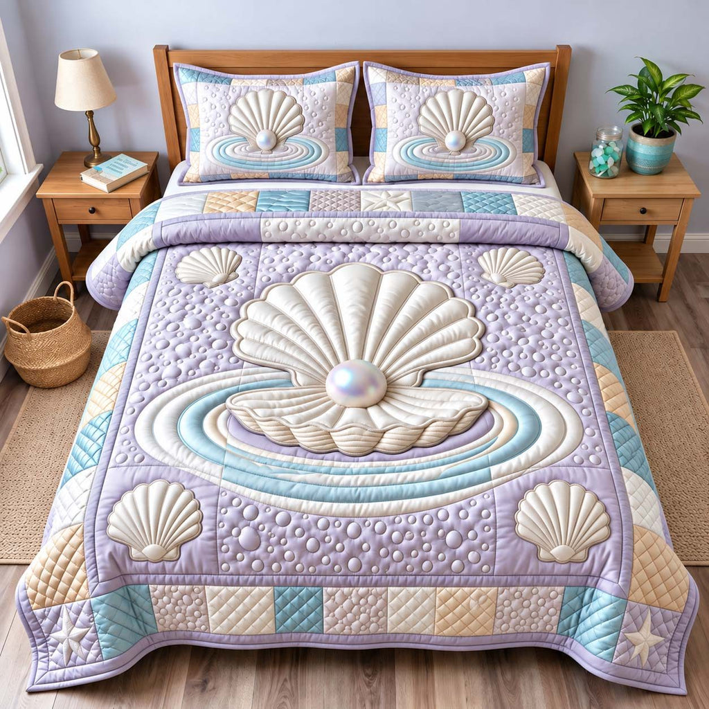Pearl Seashell quilted 3-piece bedding set on a made bed in a light coastal bedroom