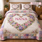 Personalized Nana Floral Heart Wreath quilted 3-piece bedding set on a made bed with two matching pillow shams