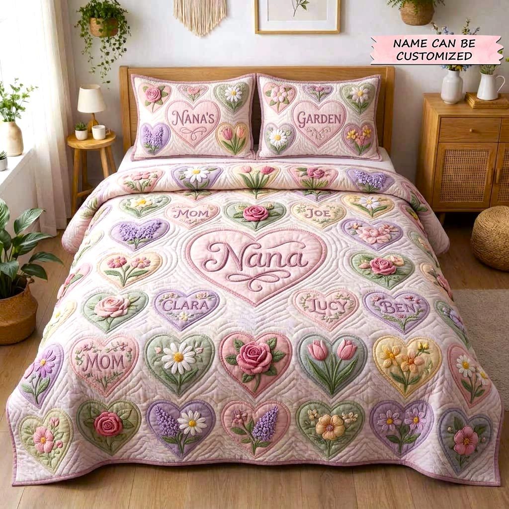 Personalized Nana Garden Grandkids Names quilted 3-piece bedding set on a made bed with two matching pillow shams