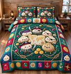 Pirate Treasure Dumplings quilted 3-piece bedding set on a made bed with two matching pillow shams