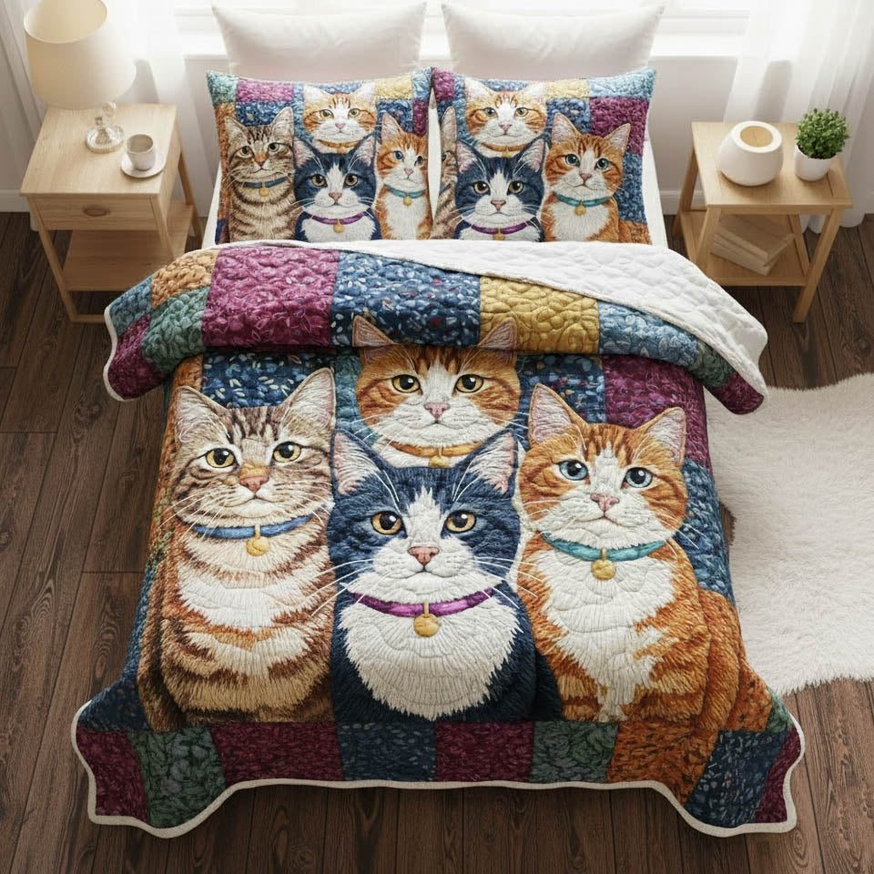 Playful Kittens Squares quilted 3-piece bedding set on a made bed with two matching pillow shams