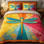 Rainbow Dragonfly Bright quilted 3-piece bedding set on a made bed with two matching pillow shams