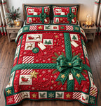 Red Gift Tag Sleigh quilted 3-piece bedding set on a made bed in a winter-styled bedroom