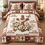 Rose Butterfly Cross quilted 3-piece bedding set on a made bed in a softly lit bedroom
