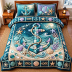 Sea Glass Ocean Anchor quilted 3-piece bedding set on a made bed in a light coastal bedroom