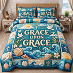 Seashell Waves Grace Upon Grace quilted 3-piece bedding set on a made bed in a light coastal bedroom