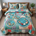 Seaside Tide Pools quilted 3-piece bedding set on a made bed in a light coastal bedroom