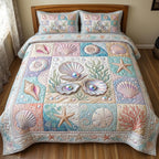 Shoreline Serenity Shells quilted 3-piece bedding set on a made bed in a light coastal bedroom