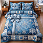 Silver Bow Snowflake Gift quilted 3-piece bedding set on a made bed in a winter-styled bedroom