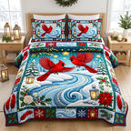 Snowy River Red Cardinal quilted 3-piece bedding set on a made bed with two matching pillow shams