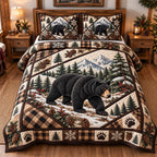 Snowy Slope Black Bear quilted 3-piece bedding set on a made bed with two matching pillow shams