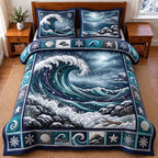 Stormy Ocean quilted 3-piece bedding set on a made bed in a light coastal bedroom