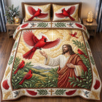 Sunlit Cardinals Of Hope quilted 3-piece bedding set on a made bed with two matching pillow shams