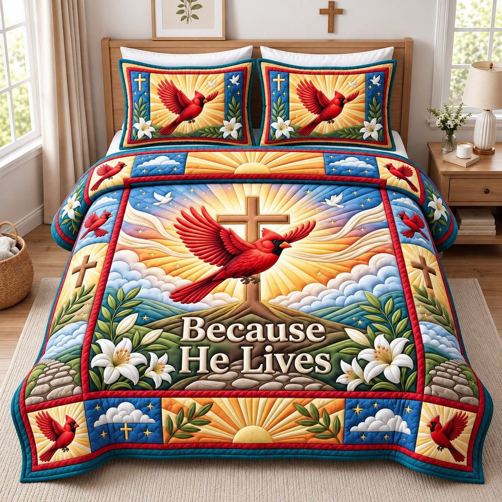 Sunrise Cardinal Because He Lives quilted 3-piece bedding set on a made bed with two matching pillow shams
