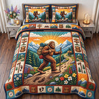 Sunrise Hiking Bigfoot quilted 3-piece bedding set on a made bed with two matching pillow shams