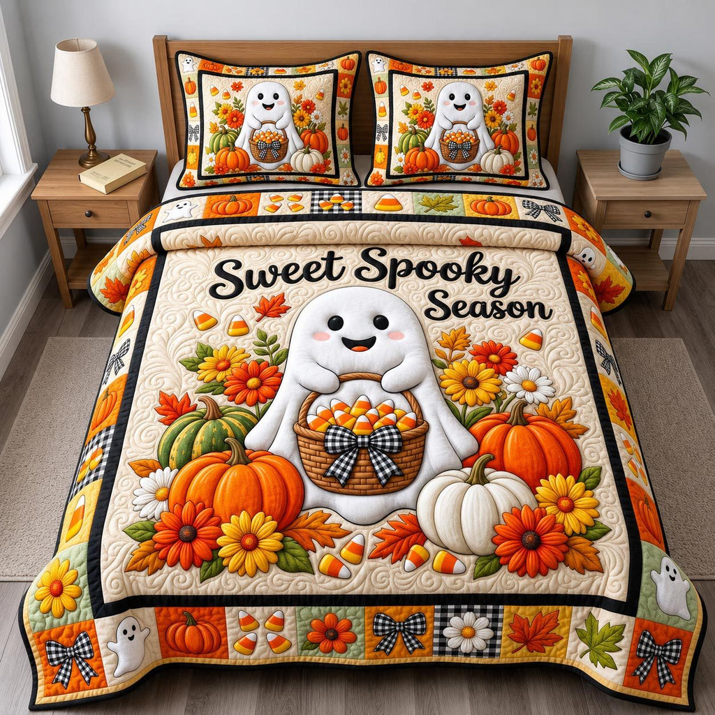 Sweet Spooky Season Ghost quilted 3-piece bedding set on a made bed against a dark styled interior