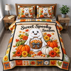 Sweet Spooky Season Ghost quilted 3-piece bedding set on a made bed against a dark styled interior