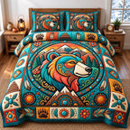 Teal Mountain Native Bear quilted 3-piece bedding set on a made bed with two matching pillow shams
