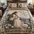 The Caring Shepherd quilted 3-piece bedding set on a made bed with two matching pillow shams