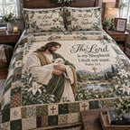 The Loving Shepherd quilted 3-piece bedding set on a made bed with two matching pillow shams
