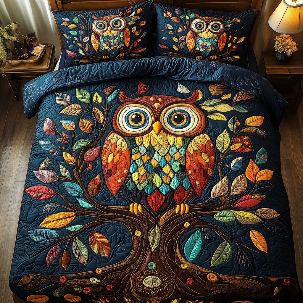The Owlchemy Dark quilted 3-piece bedding set on a made bed with two matching pillow shams