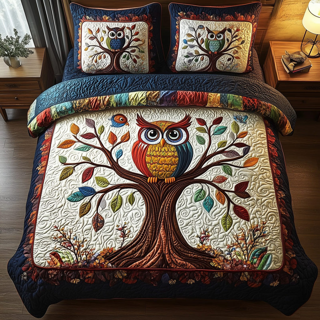 The Owlchemy Rainbow quilted 3-piece bedding set on a made bed with two matching pillow shams