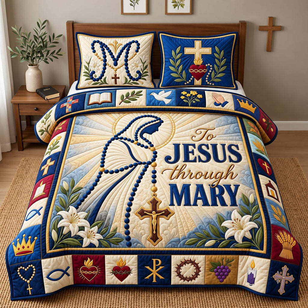 To Jesus Through Mary quilted 3-piece bedding set on a made bed in a softly lit bedroom