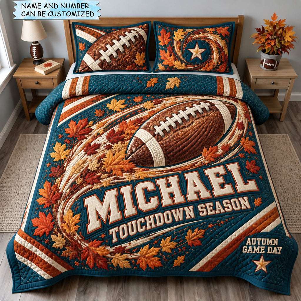 Touchdown Season 3-Piece Quilted Bedding Set QTCUZ quilted 3-piece bedding set on a made bed with two matching pillow shams