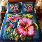 Tropical Blooming Hummingbird quilted 3-piece bedding set on a made bed in a light coastal bedroom