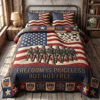 Veteran Pride Priceless quilted 3-piece bedding set on a made bed in a warmly lit bedroom