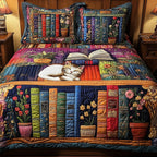 Vintage Cat Bookshelf Navy quilted 3-piece bedding set on a made bed in a warmly lit bedroom