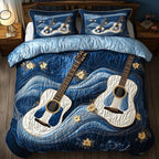 Waves Of Guitar Stars quilted 3-piece bedding set on a made bed in a light coastal bedroom