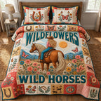 Wild Horses Wild Flowers Blue quilted 3-piece bedding set on a made bed in a rustic timber bedroom