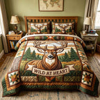 Wild Spirit Deer Heart quilted 3-piece bedding set on a made bed with two matching pillow shams