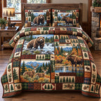 Wildlife Mountain Retreat quilted 3-piece bedding set on a made bed with two matching pillow shams