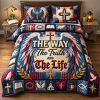 Winged Cross The Way The Truth The Life quilted 3-piece bedding set on a made bed in a softly lit bedroom