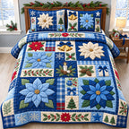 Winter Blue Poinsettia quilted 3-piece bedding set on a made bed in a winter-styled bedroom