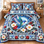 Winter Hummingbird Enchantment quilted 3-piece bedding set on a made bed in a winter-styled bedroom