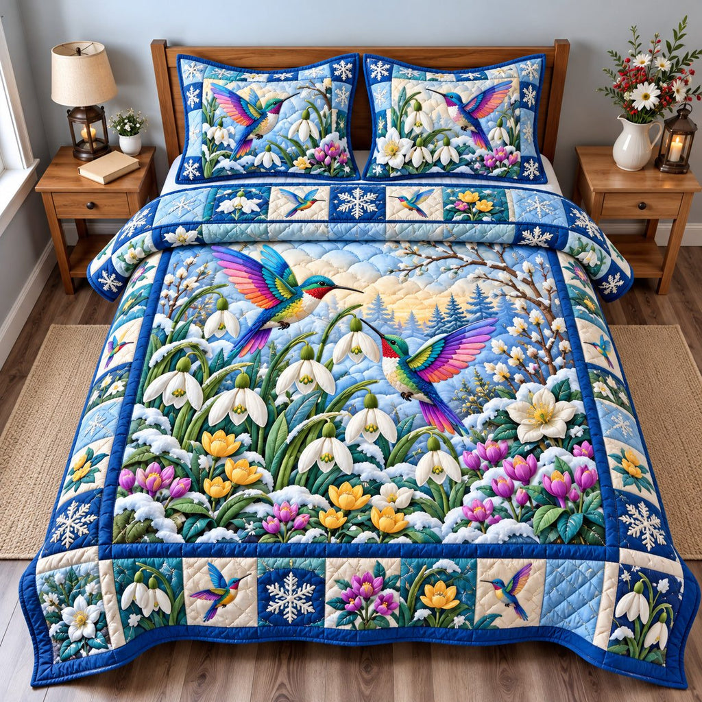 Winter Hummingbird Jewels quilted 3-piece bedding set on a made bed in a winter-styled bedroom