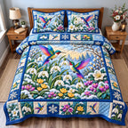 Winter Hummingbird Jewels quilted 3-piece bedding set on a made bed in a winter-styled bedroom