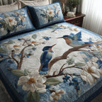 Winter Hummingbird Love Branch quilted 3-piece bedding set on a made bed in a winter-styled bedroom