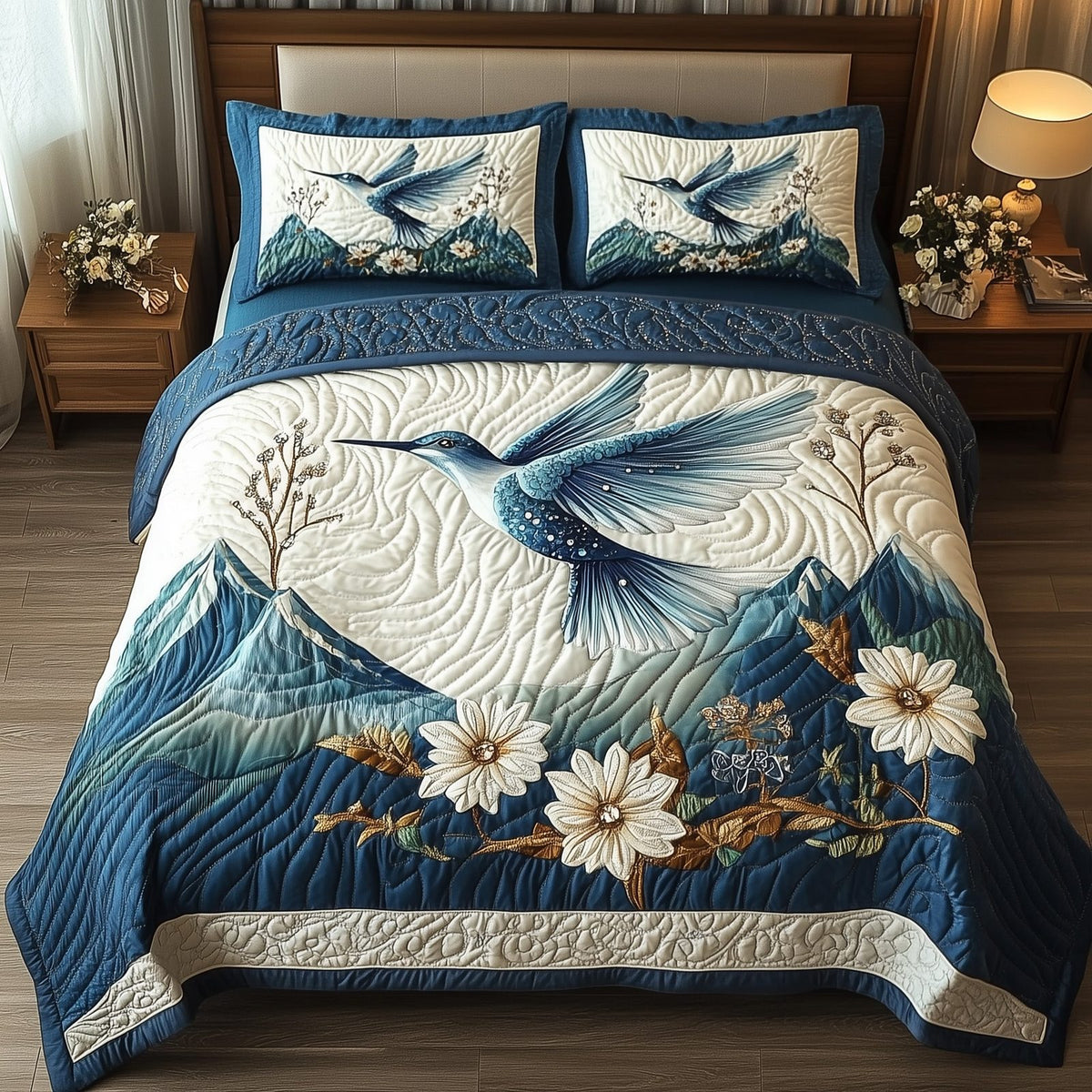 Winter Hummingbird Mountain quilted 3-piece bedding set on a made bed in a winter-styled bedroom