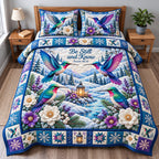 Winter Hummingbird Radiance quilted 3-piece bedding set on a made bed in a winter-styled bedroom